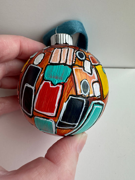 Orange, Yellow and Teal Plastic Ornament