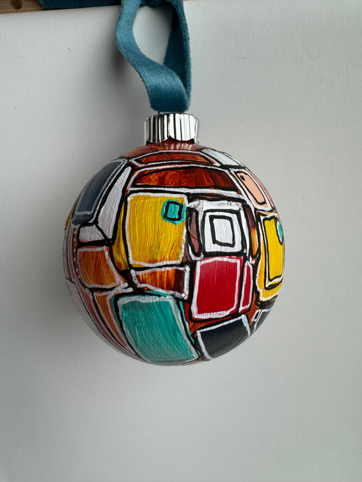 Orange, Yellow and Teal Plastic Ornament