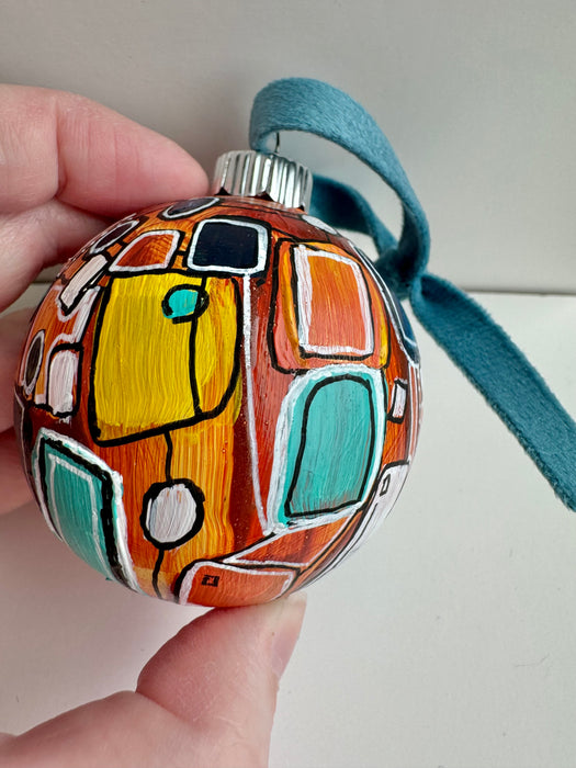 Orange, Yellow and Teal Plastic Ornament