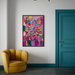 Color is My Jam, an  abstract framed wall art print by Portland Artist Leah Nadeau, hangs on a white wall in a modern room setting, featuring a mustard yellow armchair and a teal door.